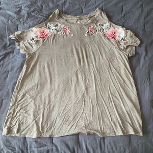 Green top with floral accents